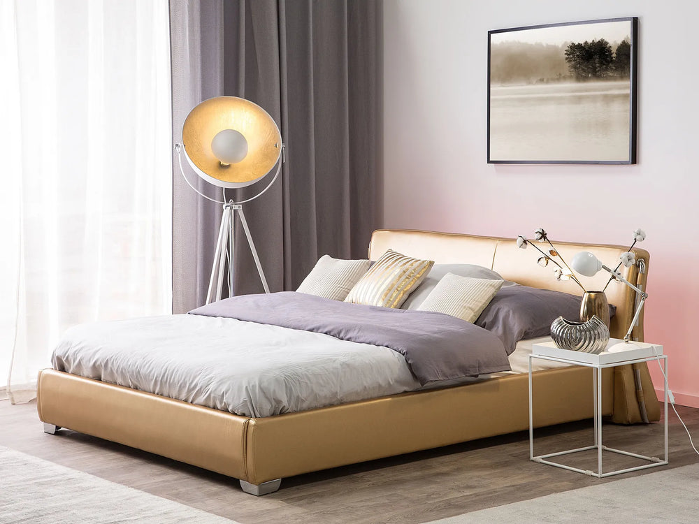 Modern bedroom with a beige bed, side table, and floor lamp.