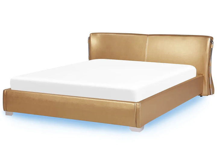 Gold bed frame with white mattress on a white background