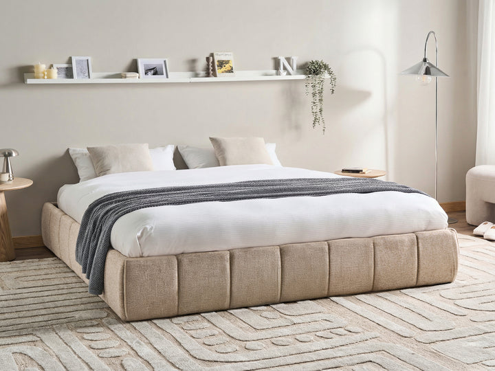 Low-profile beige upholstered bed