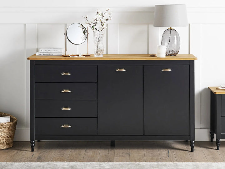 Black dresser with wooden top in a room setting