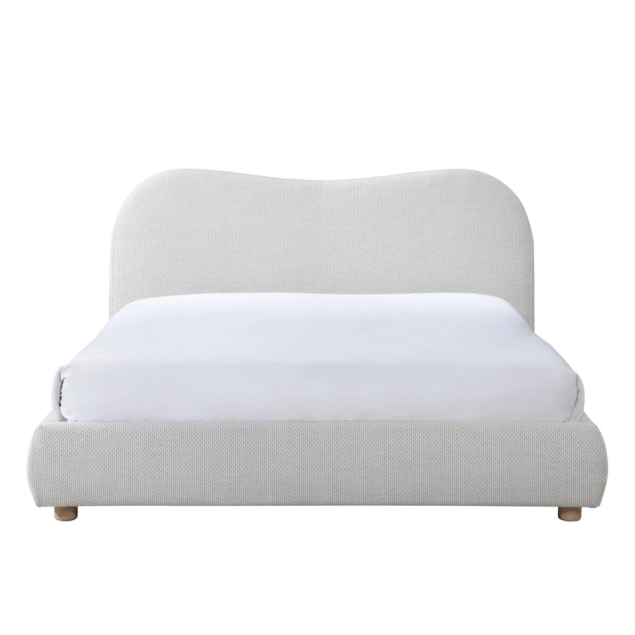 Light gray upholstered bed with a white mattress on a white background