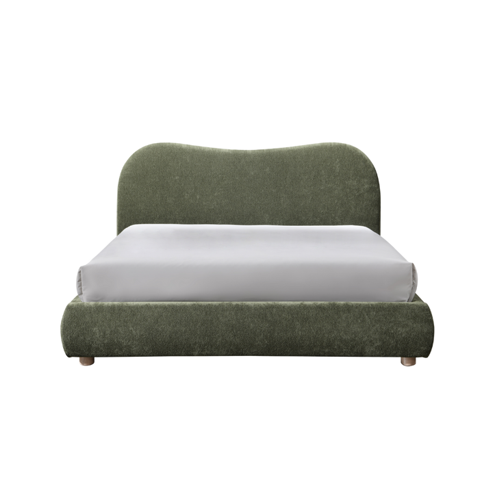 Green upholstered bed with a white mattress on a white background