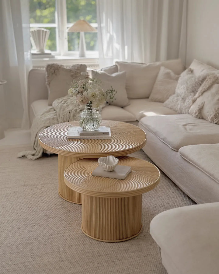 Living room with beige sectional sofa and wicker coffee table