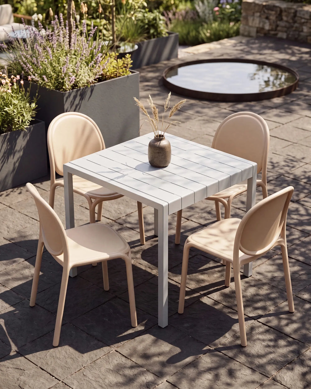 A 5-piece outdoor dining set consisting of a square slatted table and four matching chairs, styled on a stone patio with a small water feature in the background.