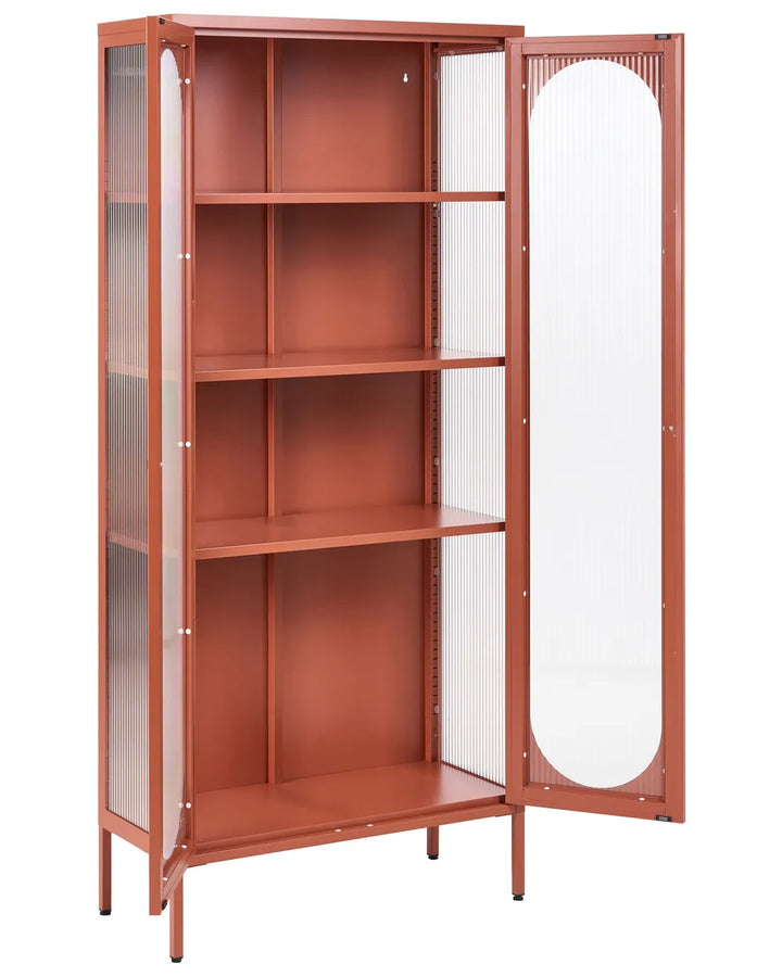 A tall rust-colored metal bookcase with four shelves and two glass-paneled doors, one of which is open, shown against a plain white background.