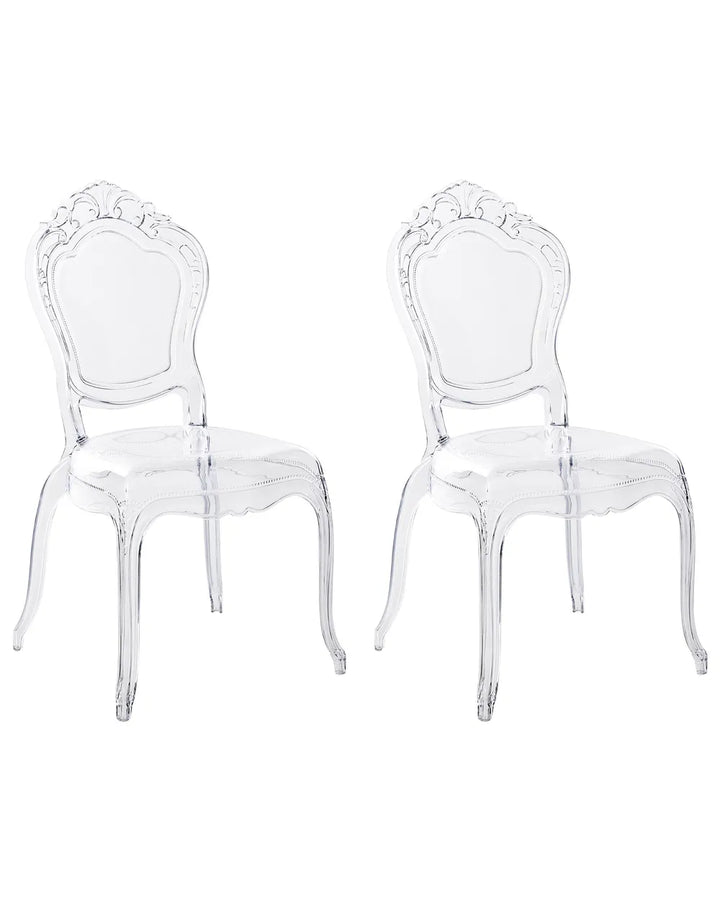 Two clear acrylic dining chairs with ornate baroque-style backs, shown side by side on a plain white background.