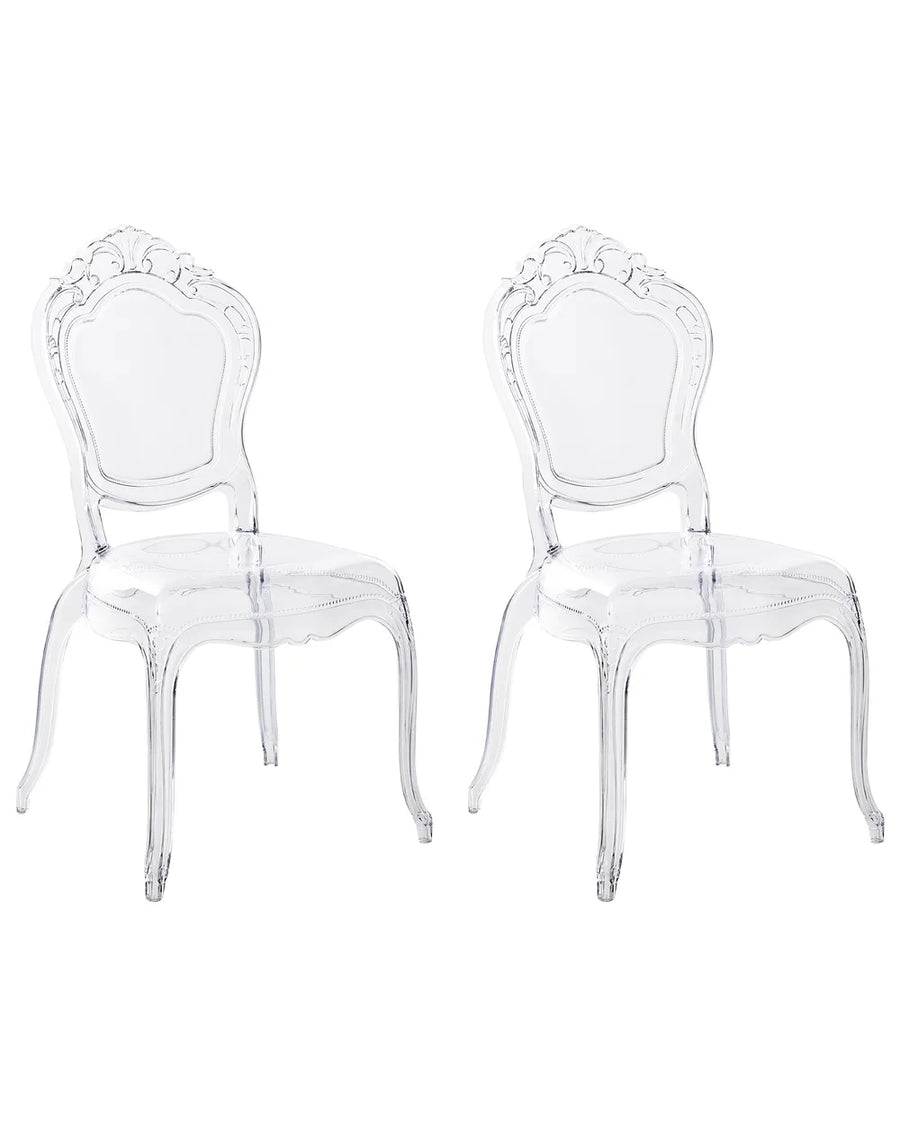 Two clear acrylic dining chairs with ornate baroque-style backs, shown side by side on a plain white background.