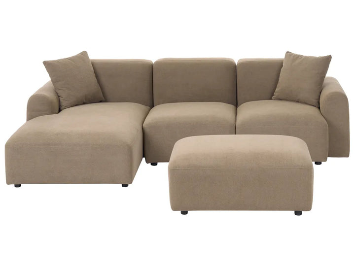 A modern beige fabric sectional sofa with a left-facing chaise lounge and two matching throw pillows, paired with a matching rectangular ottoman, shown against a plain white background.