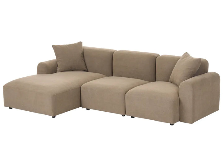 A modern L-shaped sectional sofa in a warm taupe beige fabric, featuring a chaise lounge on the left, two back cushions, and two matching throw pillows, shown against a plain white background.