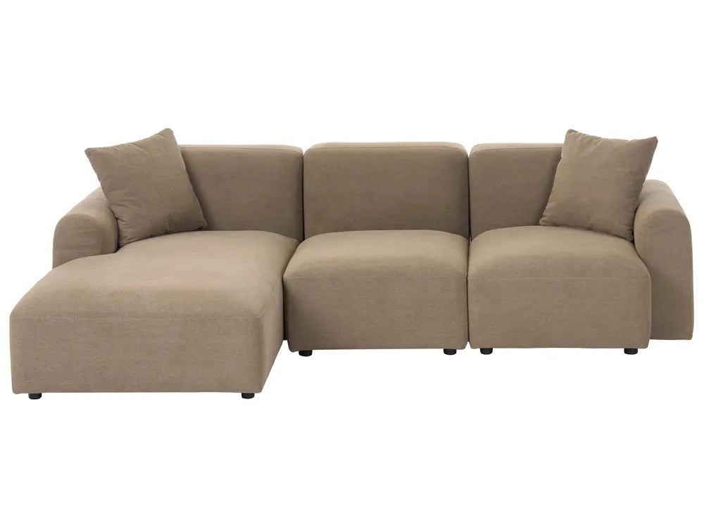A modern three-seater sectional sofa with a left-facing chaise lounge, upholstered in a textured taupe fabric, featuring two matching throw pillows, shown against a plain white background.