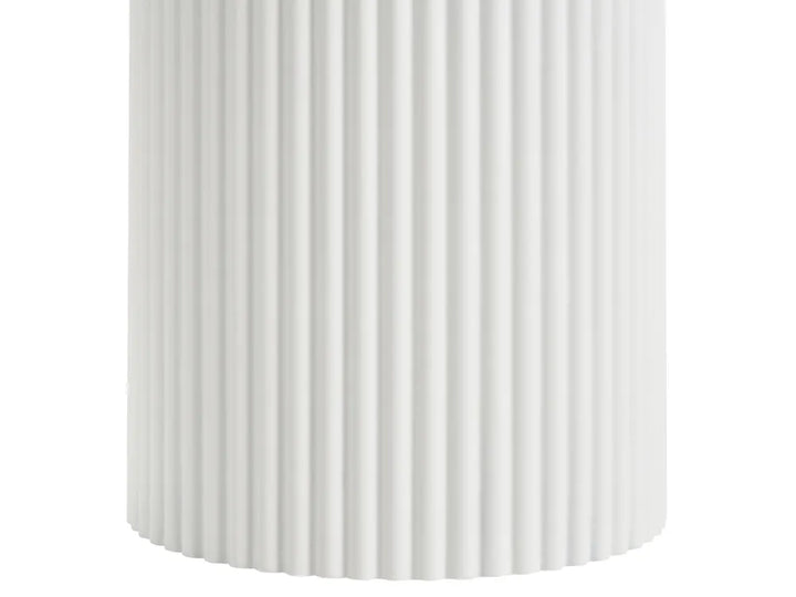 A close-up of a white cylindrical product with vertical fluted ridges, shown against a plain white background.