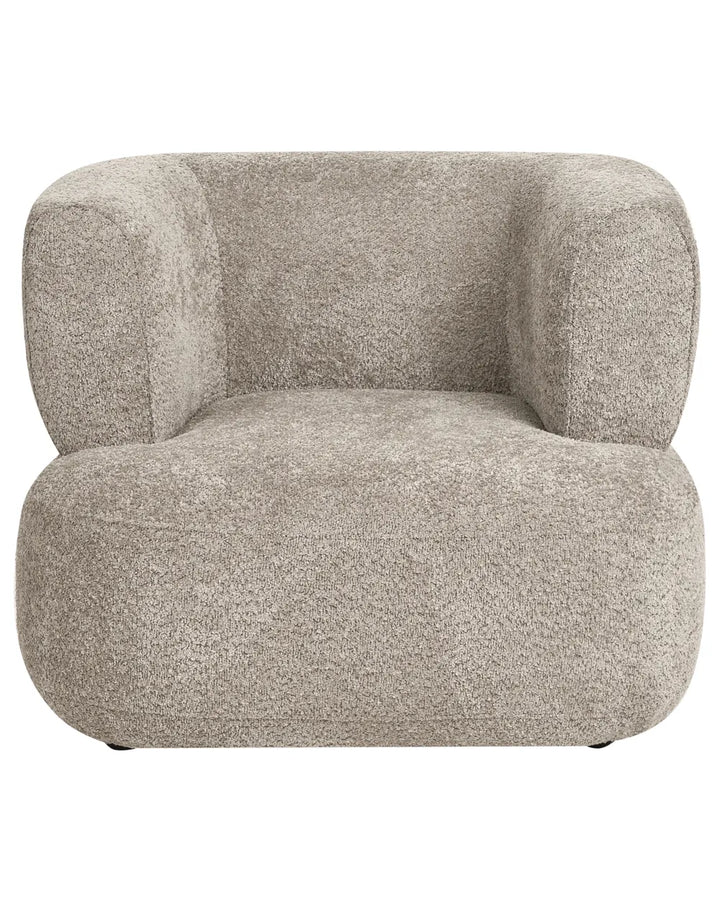 A modern low-profile armchair upholstered in a textured, boucle-like fabric in a warm light gray or greige color, shown against a plain white background.