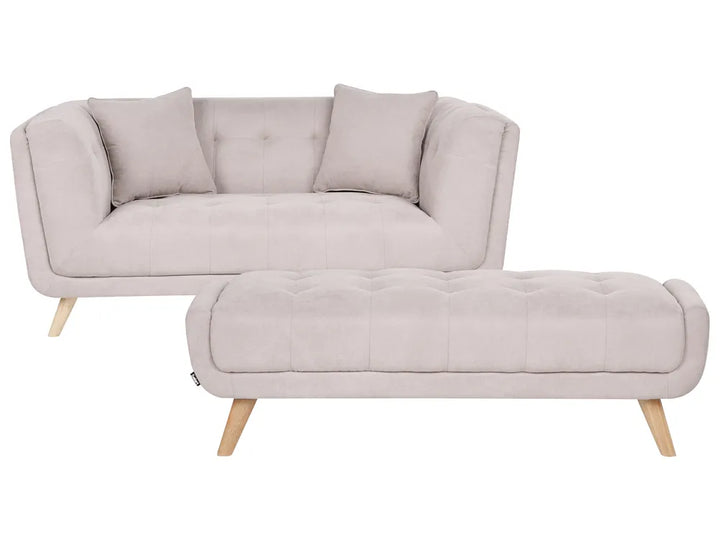 A light beige upholstered loveseat with two matching back cushions and a matching tufted ottoman, both supported by light wood legs, shown on a plain white background.