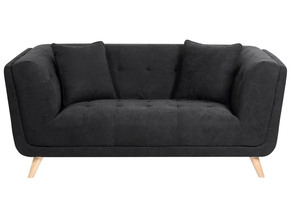 A modern black fabric loveseat sofa with tufted details, two matching back cushions, and light wood legs, shown against a plain white background.