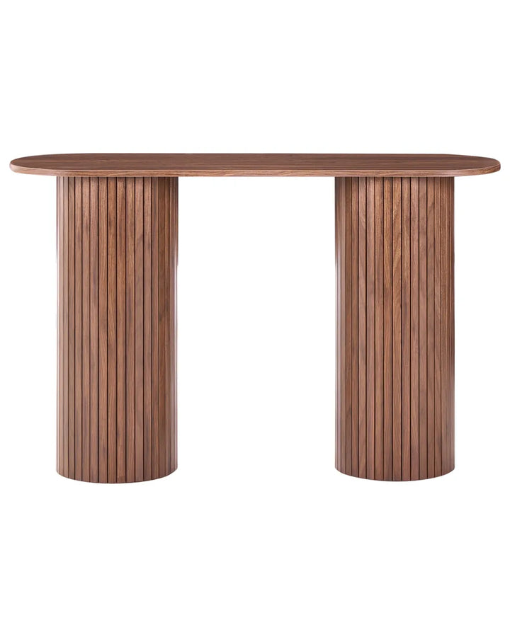 A modern wooden console table with a rounded rectangular top and two fluted cylindrical pedestal legs in a medium brown finish, isolated on a white background.