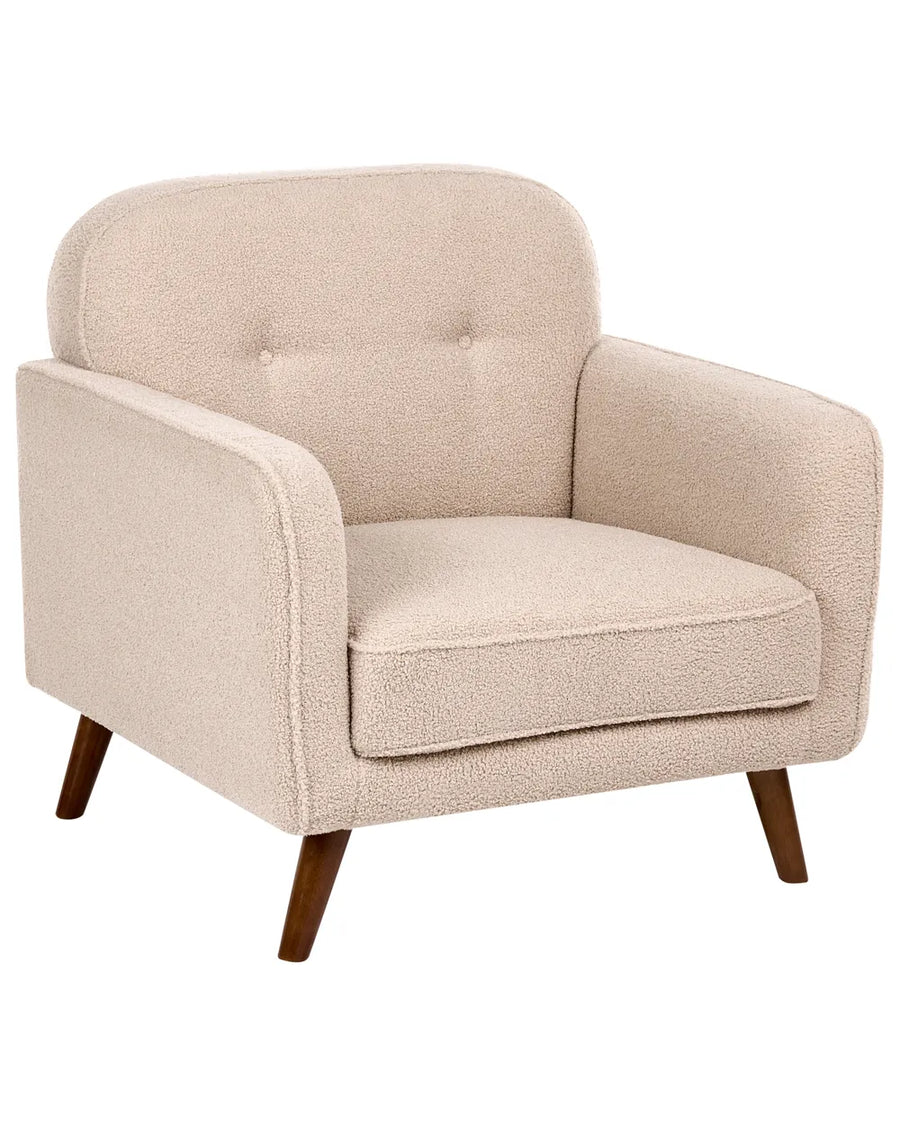 A single upholstered armchair with a rounded back, wide armrests, tufted button detailing on the backrest, and tapered dark wood legs, shown on a plain white background.