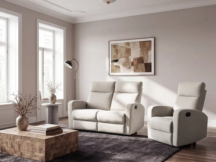 Modern living room with a beige sofa and armchair, wooden coffee table, and abstract art on the wall.