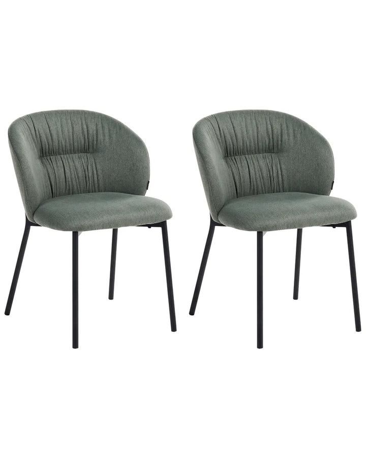 Two matching upholstered dining chairs with rounded backs, channel-tufted vertical stitching, and black metal legs, shown on a plain white background.