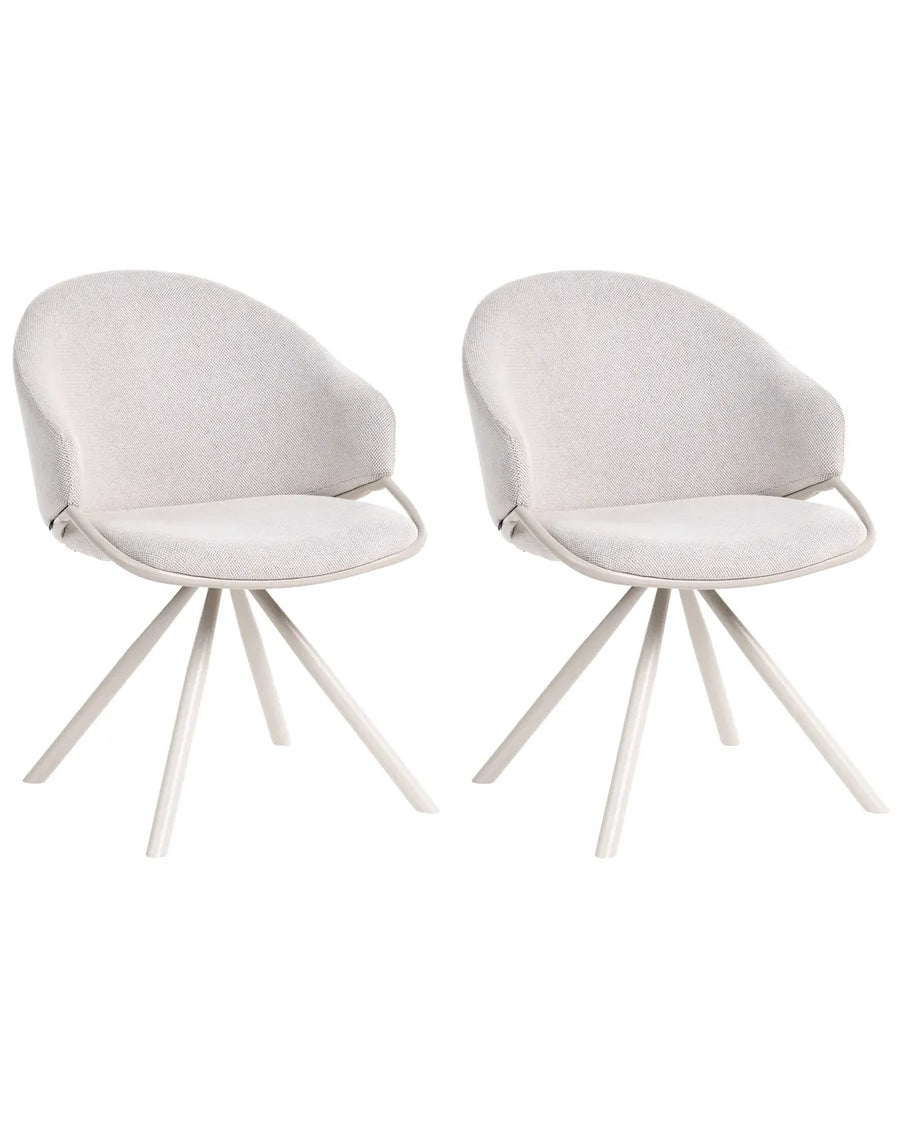 Two modern dining chairs with light beige textured fabric upholstery and white metal tripod legs, shown side-by-side on a white background.