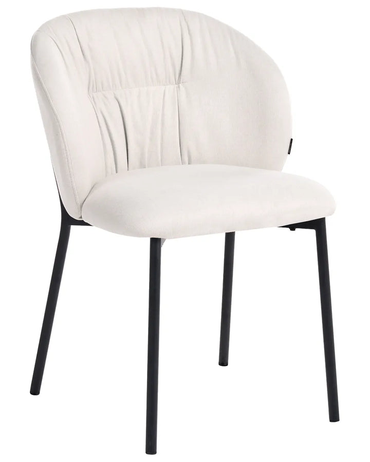 An upholstered dining chair with a cream-colored fabric seat and backrest, supported by slim black metal legs, shown against a plain white background.