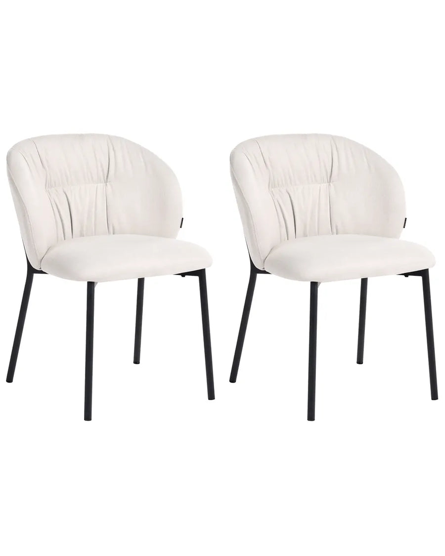 Two modern dining chairs with cream-colored upholstered seats and curved backs, supported by slim black metal legs, shown against a plain white background.