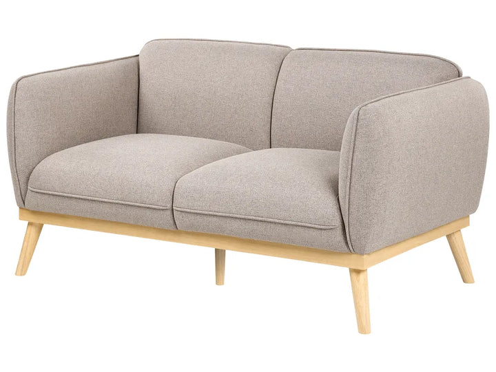 A modern two-seater sofa with light beige textured fabric upholstery and a natural light wood frame with tapered legs, shown on a plain white background.