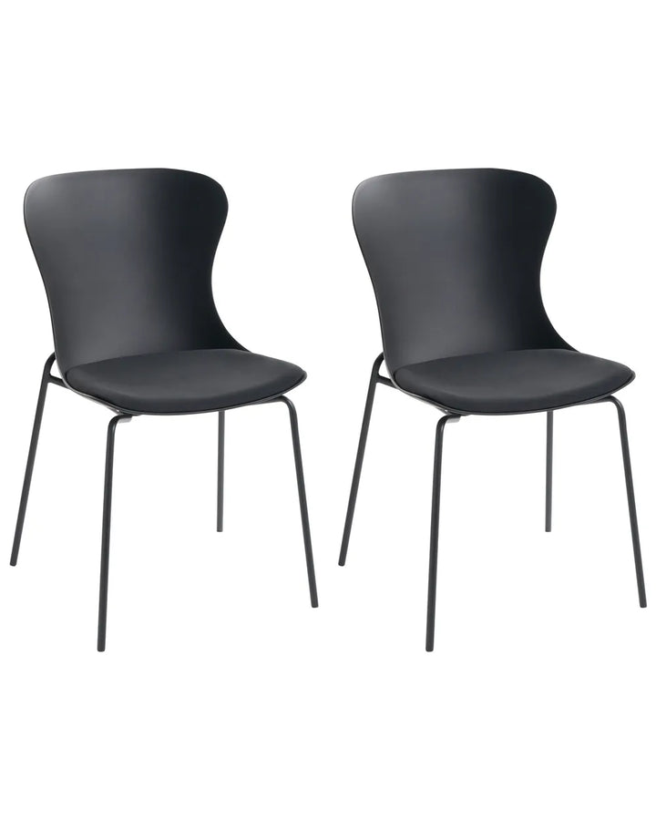 Two modern black dining chairs with curved backs and slim metal legs, shown side by side on a plain white background.