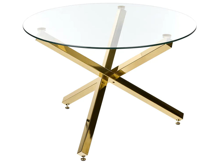 A round glass-top table with a polished gold metallic X-shaped base, shown on a plain white background.