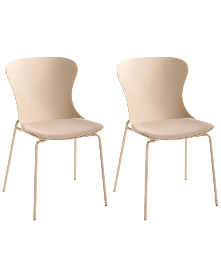 Two modern dining chairs with curved beige plastic seats and backs and slim gold-toned metal legs, shown on a plain white background.