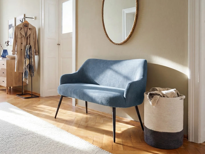 Blue sofa in a room with wooden floor and beige walls