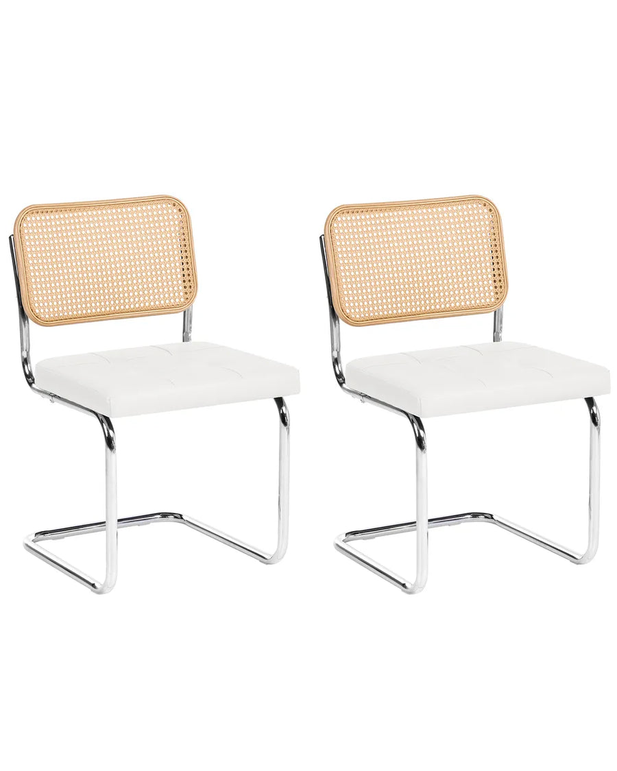 Two matching modern dining chairs with white upholstered seats, natural woven cane backrests, and chrome cantilevered metal bases, shown on a plain white background.