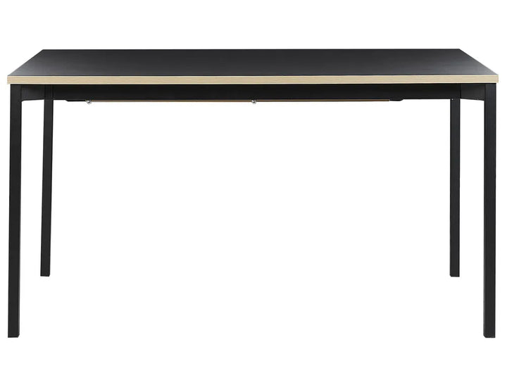 A rectangular desk with a black top and slim black metal legs, featuring a light beige wood-grain edge trim, shown against a plain white background.