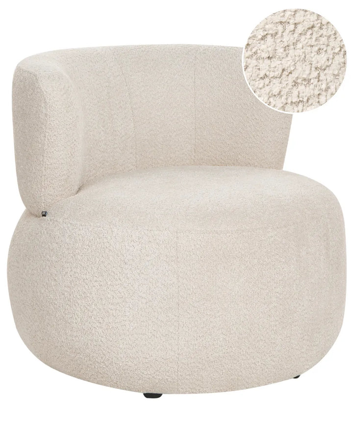 A round, low-profile accent chair upholstered in a textured bouclé fabric in a warm cream or off-white color, featuring a circular fabric texture inset in the upper right corner.
