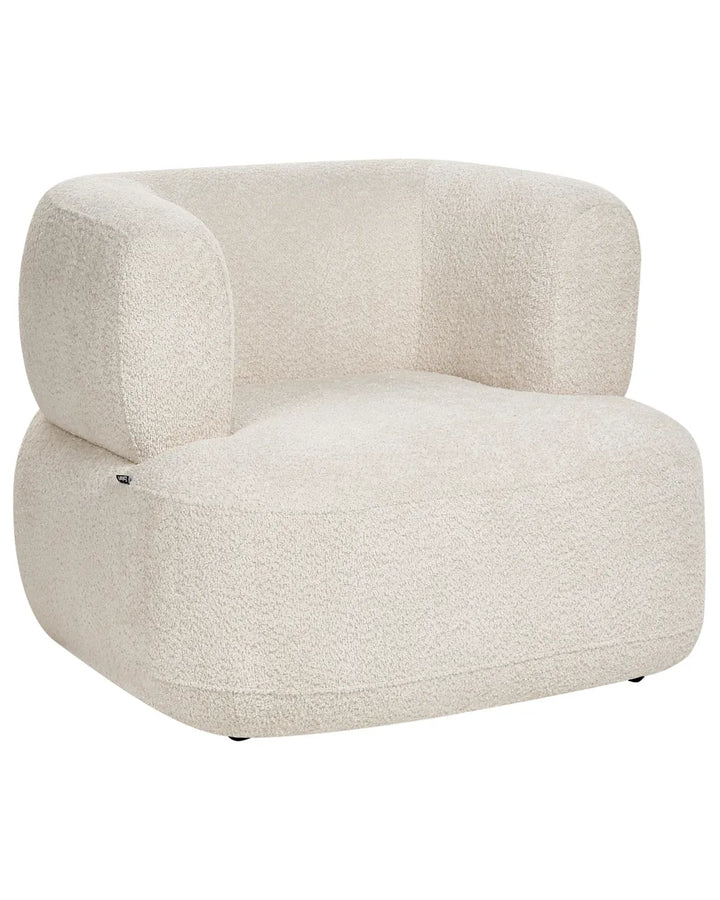 A modern low-profile armchair upholstered in a textured bouclé fabric in a warm off-white or cream color, shown against a plain white background.