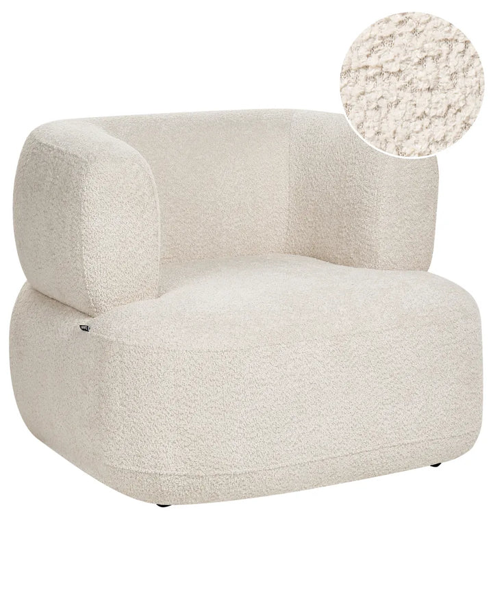 A modern low-profile armchair upholstered in a textured bouclé fabric in a warm off-white/cream color, featuring a circular fabric texture inset in the top right corner.