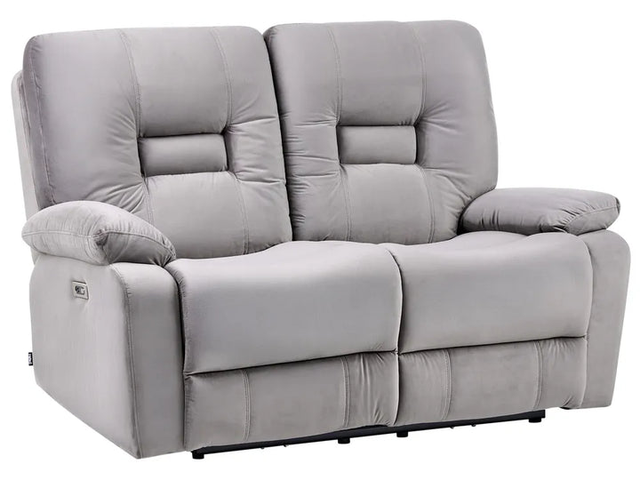 A light gray upholstered reclining loveseat with two padded backrests, wide armrests, and visible power-control buttons on the outer sides, shown on a plain white background.