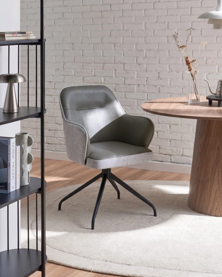 Gray swivel chair in a modern room with a wooden table and bookshelf.