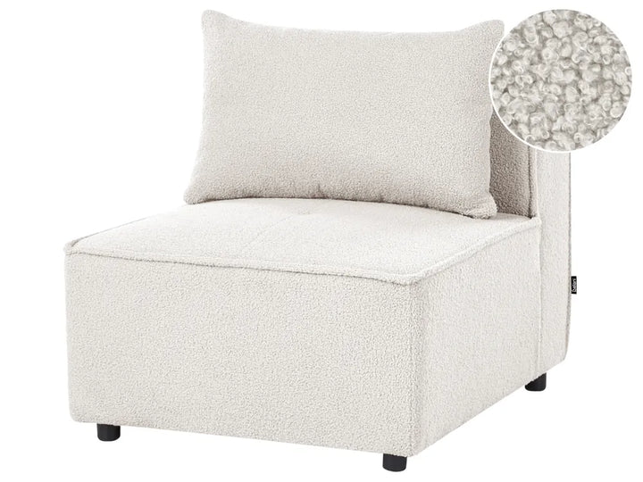 A cream bouclé upholstered corner chair with a matching back cushion and a circular fabric close-up inset in the top right, shown on a plain white background.
