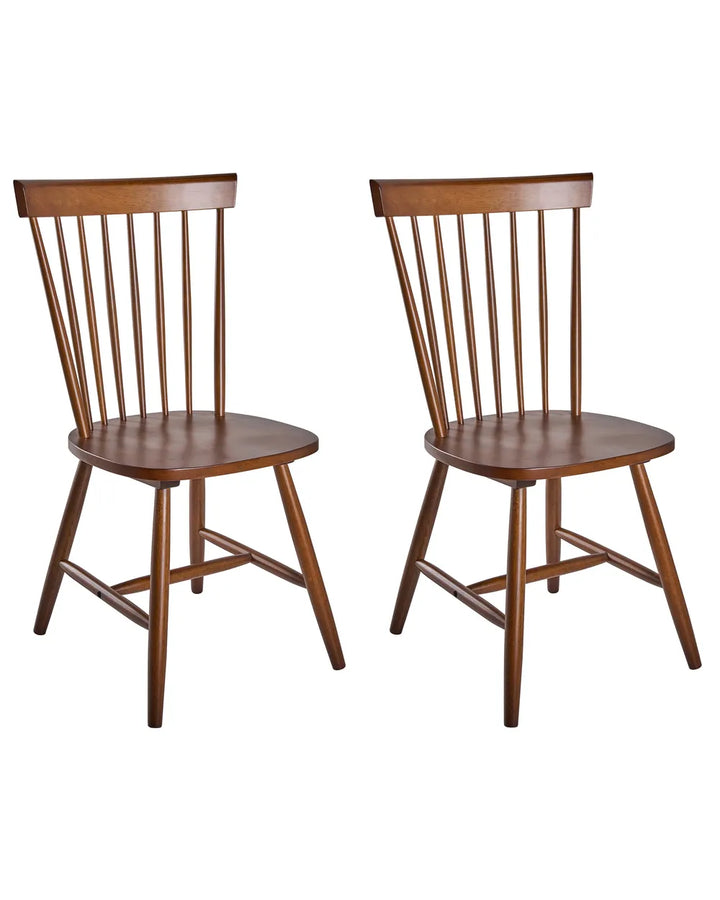 Two wooden dining chairs with spindle backs and straight legs, shown side by side on a plain white background.