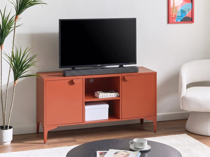 Orange TV stand with a black television in a living room setting.