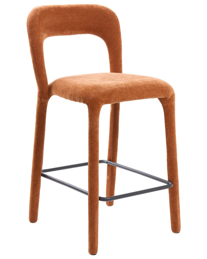 A modern bar stool with a curved backrest and seat upholstered in a warm rust-orange velvet fabric, supported by four tapered legs and a black metal square frame base, shown on a plain white background.