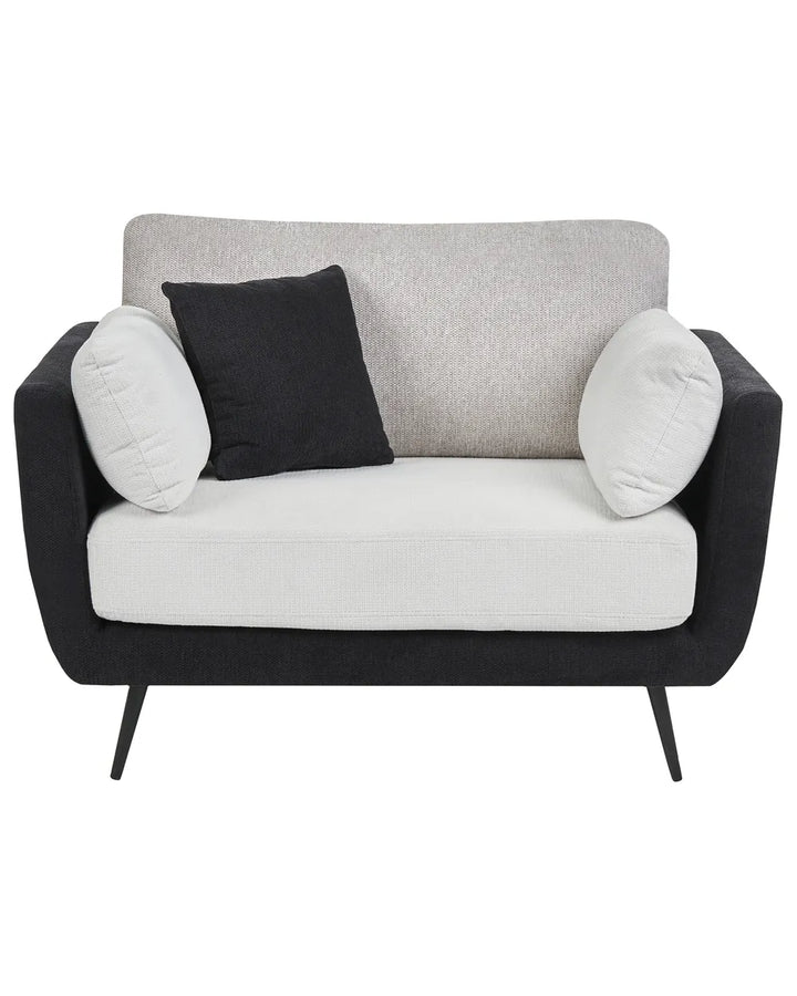 A modern two-seater loveseat sofa with a black fabric frame and legs, a light gray textured backrest, a white seat cushion, and two throw pillows (one black, one white), shown against a plain white background.