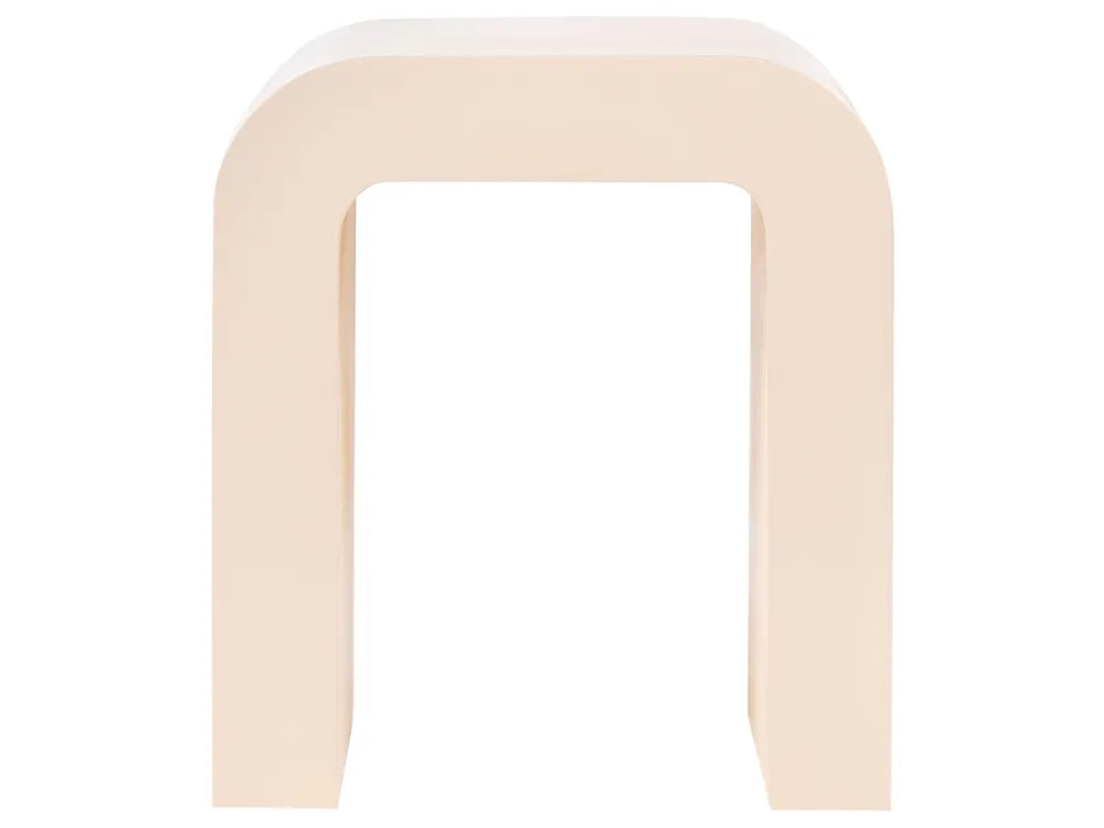 A minimalist U-shaped stool in a solid cream color, photographed from a direct front angle against a seamless white background.