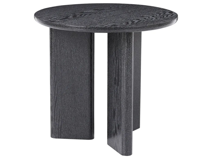 A round side table with a dark charcoal gray wood grain finish, featuring three blocky legs, shown against a plain white background.