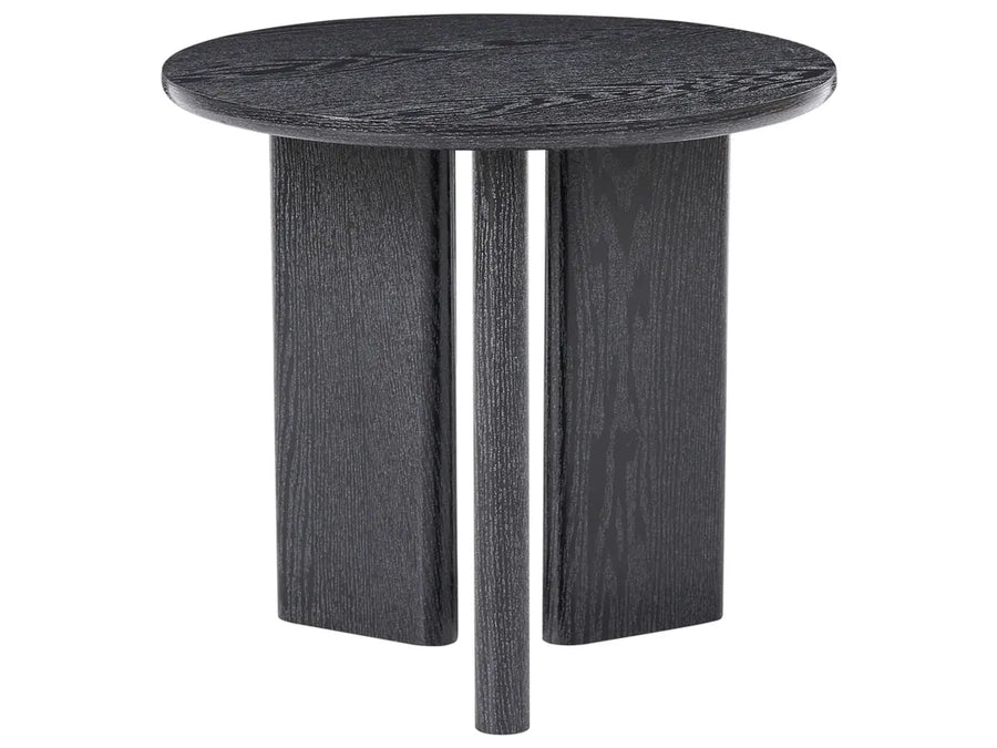A round side table with a dark charcoal gray wood grain finish, featuring a thick circular top and three blocky, tapered legs, shown against a plain white background.