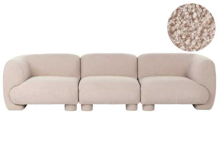 A three-seater modular sofa in a light beige bouclé fabric, shown from a front angle with a circular fabric texture inset in the top right corner.