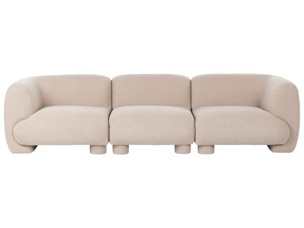A modern three-seater sofa upholstered in a light beige textured fabric, featuring rounded blocky arms and cylindrical legs, shown against a plain white background.
