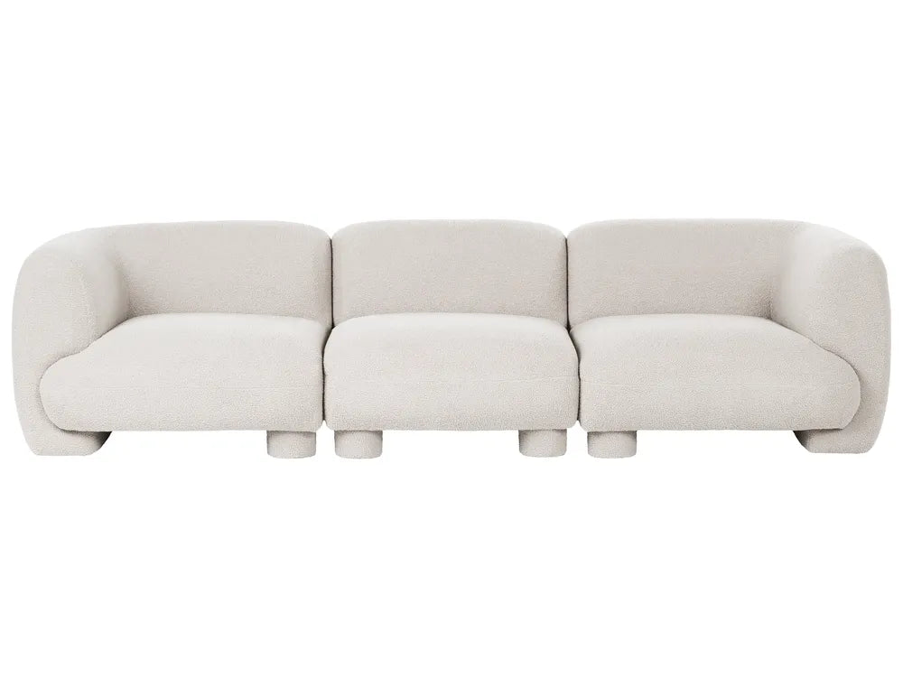A modern three-seater modular sofa upholstered in a light beige textured fabric, shown from a straight-on perspective against a solid white background.