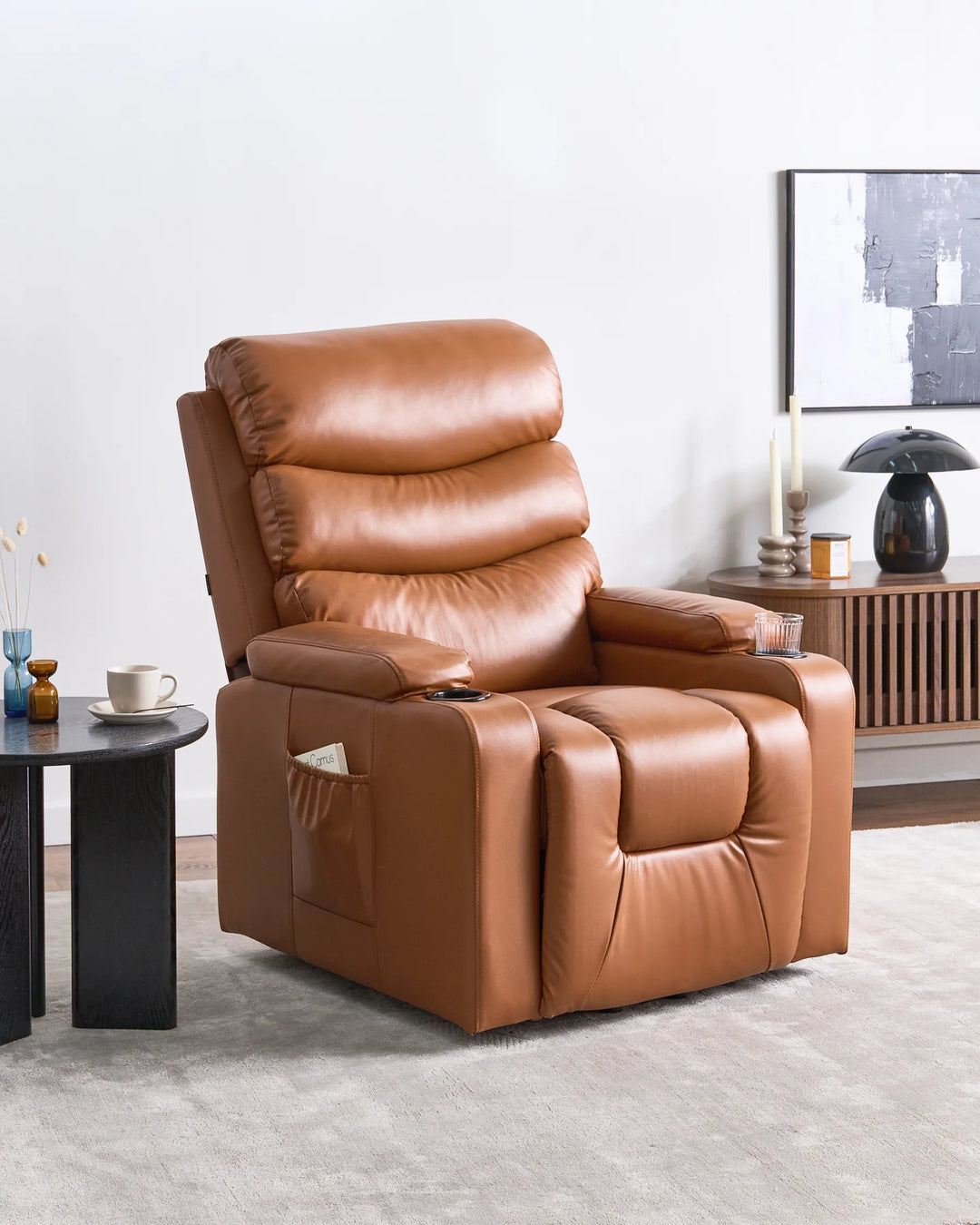 A tan faux leather recliner chair with a fully extended footrest.