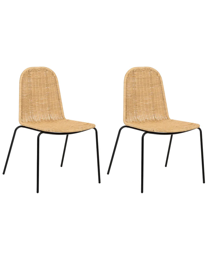 Two matching dining chairs with woven natural rattan seats and backs and slim black metal legs, shown side by side on a plain white background.